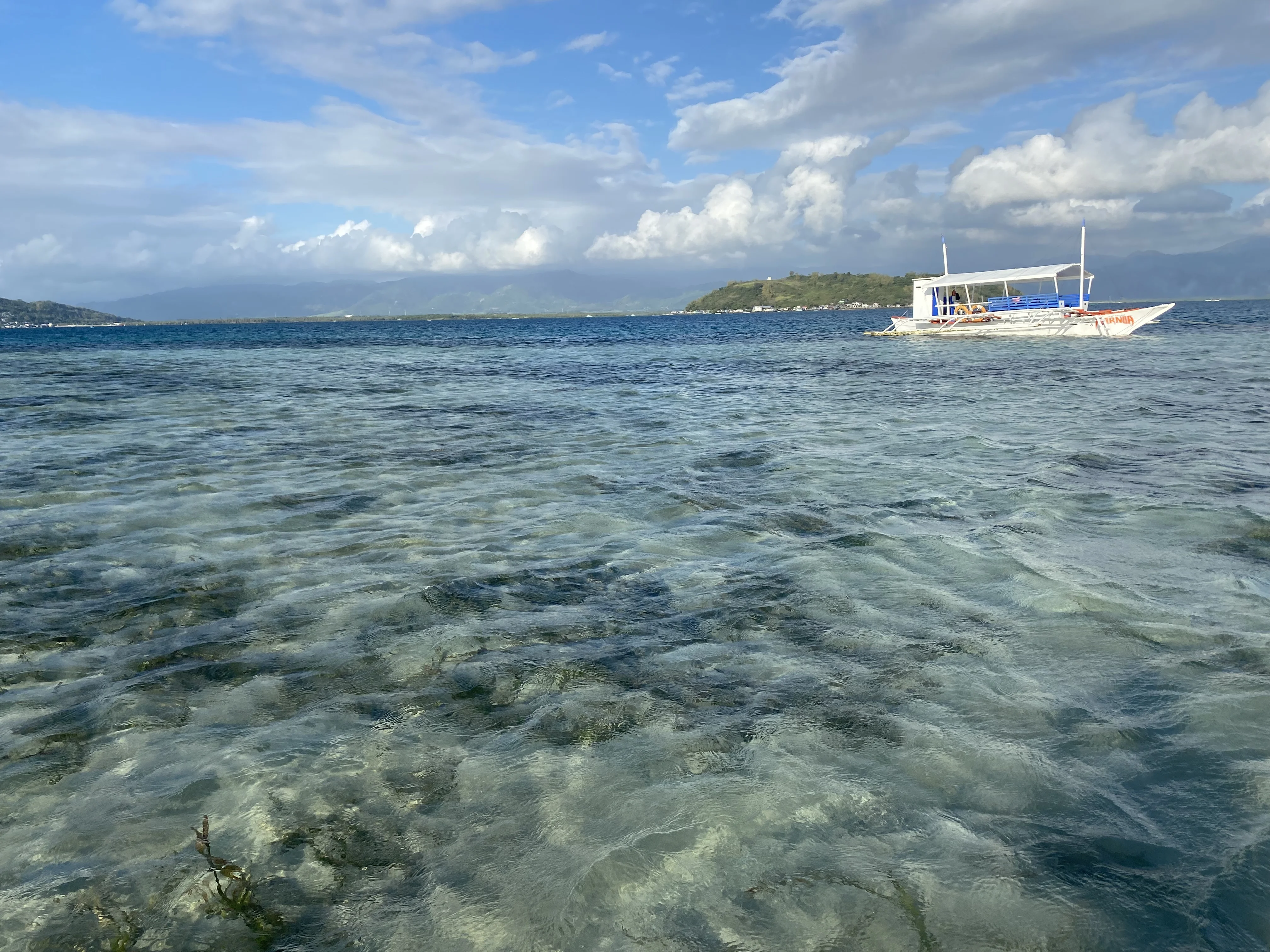 Boat anchored near the sandbar
