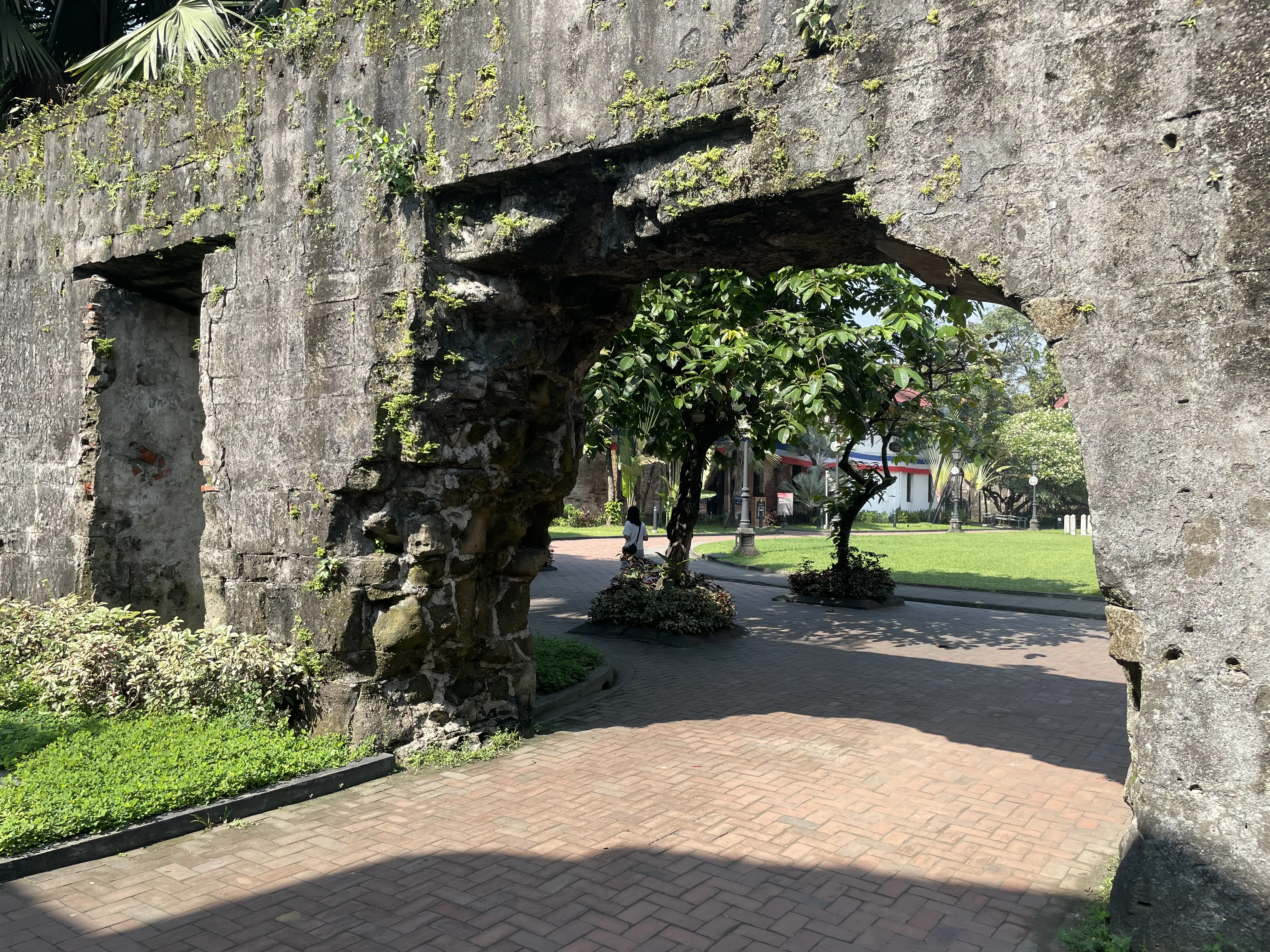 A walkway within a broken arch at Fort Santiago